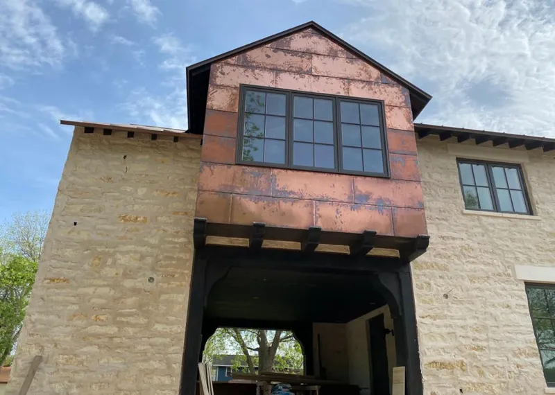 Copper metal panel facade on a stone building for Metal Roof Coating in Leesburg
